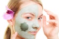 Skin care. Woman in clay mud mask on face. Beauty. Royalty Free Stock Photo