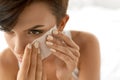 Skin Care. Woman Cleaning Face With Oil Absorbing Papers.