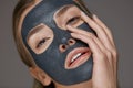 Skin care. Woman face with cosmetic spa clay mask closeup Royalty Free Stock Photo