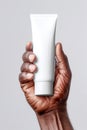 Skin moisturising concept. Top above overhead pov first person view photo of female hands holding tube of cream