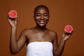 Skin Nutrition. Portraif Of Beautiful African American Woman With Two Grapefruit Halves