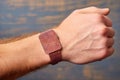 skin patch test on a wrist with a watch nearby