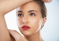 Skin perfection. Closeup beauty shot of an attractive young woman framing her head with her arms. Royalty Free Stock Photo