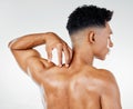 Skincare, back muscle of man and strong for wellness, being confident with studio background. Rear view, male and Royalty Free Stock Photo