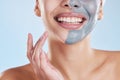 Skincare, beauty and face mask with a beautiful woman taking care of her clean, healthy and glowing skin. Closeup smile