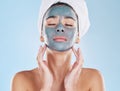 Skincare, beauty and face mask on a woman while doing her wellness routine in a studio. Latina girl with fresh, body