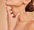 Skincare, beauty and neck of a woman with a glow isolated on a brown background in a studio. Wellness, health and a girl