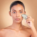 Skincare, beauty and portrait of Indian woman with gua sha, facial treatment and wellness with spa stone. Salon Royalty Free Stock Photo