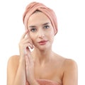 Skincare and bodycare. Young woman touching healthy facial hydrated skin. Beautiful girl with towel on head isolated on white Royalty Free Stock Photo