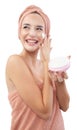 Skincare, cheerful young woman laughing, applying moisturizing cream on face, lotion or mask for skin lifting and anti-aging, Royalty Free Stock Photo
