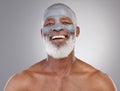 Skincare, clay mask and portrait of black man with smile, happiness and anti ageing treatment on studio background