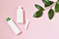 Skincare cosmetics bottles with green plant background