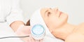 Skincare cosmetology facial procedure. Beauty woman face. Blue light medical therapy. Specialist hand Royalty Free Stock Photo