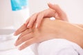 Skincare, cream and hands closeup in spa therapy, touch massage or wellness. Fingers, nails or woman apply lotion in Royalty Free Stock Photo