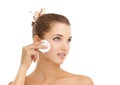 Skincare, face or cotton pad for woman in studio for wellness, shine or glow on white background. Cleaning, beauty or