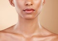 Skincare, face and mouth of a woman with a glow isolated on a studio background. Beauty, makeup and a girl glowing from