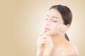 Skincare and health and cosmetics concept - beautiful asian young woman face with wrinkles Royalty Free Stock Photo