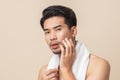 Asian man worry have blemish on face caused by acne