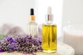 Skincare oil, lavender serum, lavender essential oil. Set lavender bath cosmetics products in bottles with fresh lavender flowers