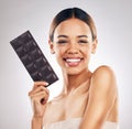 Skincare, portrait and happy woman in studio with dark chocolate for anti aging benefits on white background. Sugar