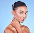 Skincare, portrait and woman in studio for wellness, cosmetic or treatment on blue background. Face, beauty and Indian