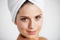 Skincare, portrait and woman with towel in a studio for health, wellness and natural face routine. Smile, beauty and