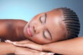 Skincare, relax and black woman in studio, sleeping and natural makeup with dermatology at luxury spa. Cosmetics, rest