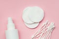 Makeup removing, white facial cotton pads, ear sticks and bottle of micellar water, woman skin and body care products isolated on Royalty Free Stock Photo