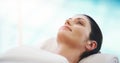 Skincare, salon and woman relax at spa for massage, facial treatment and luxury pamper. Aesthetic, dermatology and happy