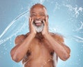 Skincare, smile and portrait of a black man with a water splash on a blue background. Cleaning, happy and an