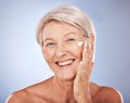 Skincare, smile and senior woman with cream on face, anti aging moisturizer treatment for wrinkles. Health, wellness and Royalty Free Stock Photo