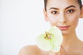 Skincare. Woman Beauty, Face Skin Care and Make Up, Girl Orchid Flower Royalty Free Stock Photo