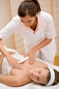 Skincare - woman cleavage massage at salon