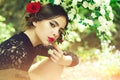 Skincare, youth, health. beauty and fashion, girl with spanish makeup, rose in hair Royalty Free Stock Photo