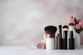 Skinimalism. Set of beauty cosmetics makeup product. Woman make up, brushes, lipstick and poudre. Makeup minimalism concept