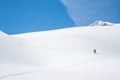 Skinning up the Asulkan Glacier in Glacier National Park, British Columbia. A man hikes on skis to access the Seven Steps to