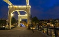 The Skinny Bridge Magere Brug at night, Amsterdam, Holland, Europe. Royalty Free Stock Photo