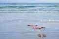 Skinny Dipping Orange Bikini on Beach Royalty Free Stock Photo