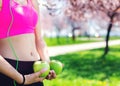 Skinny female holding green apple. Health lifestyle concept