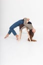 skinny female lying in bridge position on wooden ladder at studio with bare feet