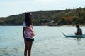 Skinny lady sightseeing at sea shore