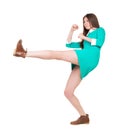 Skinny woman funny fights waving his arms and legs. Royalty Free Stock Photo