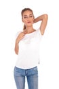 Skinny young woman in t-shirt and jeans posing