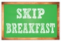 SKIP BREAKFAST words on green wooden frame school blackboard