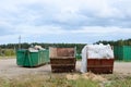 Skip for dumping renovation waste. Metal tanks and capacities for storage and transportation of garbage. Metal trash cans and