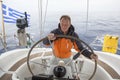 skipper drives the sailboat in the open sea. Yachting. Sailing. Royalty Free Stock Photo