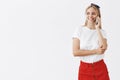 Skipping work and talking with girlfriend on phone. Portrait of charming happy skinny woman in red skirt and headband