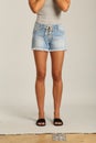 A Skirt in Blues Denim, Shorts feature a high waist, with a longer rise, relaxed leg with frayed hems, and classic five-pocket