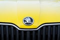 Skoda Auto automobile manufacturer from Volkswagen Group company logo on yellow dirty car Royalty Free Stock Photo