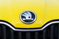 Skoda Auto automobile manufacturer from Volkswagen Group company logo on yellow dirty car Royalty Free Stock Photo